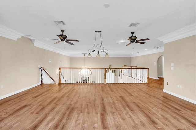 4404 Lake In The Woods Dr, Spring Hill, FL 34607 - unfurnished room with ceiling fan, ornamental molding, light wood finished floors, baseboards, and arched walkways