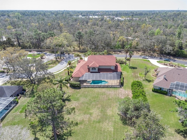 4404 Lake In The Woods Dr, Spring Hill, FL 34607 - aerial view of property and surrounding area with a heavily wooded area and a pool