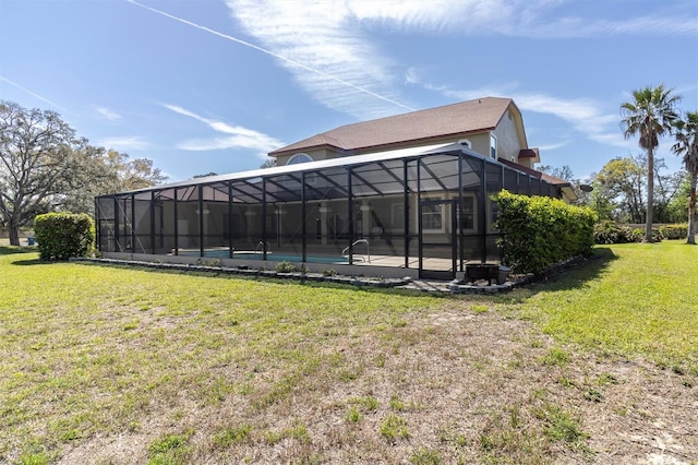 4404 Lake In The Woods Dr, Spring Hill, FL 34607 - back of house featuring a lawn, an outdoor pool, and a lanai