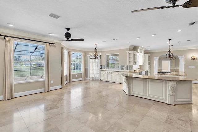 4404 Lake In The Woods Dr, Spring Hill, FL 34607 - kitchen featuring a chandelier, a ceiling fan, baseboards, crown molding, and glass insert cabinets