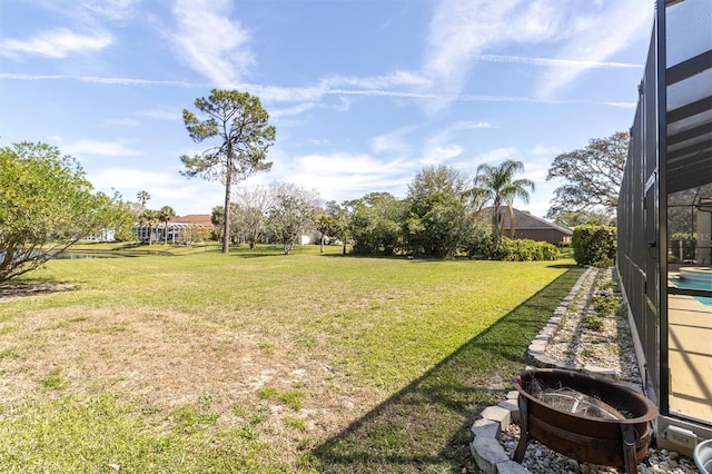 4404 Lake In The Woods Dr, Spring Hill, FL 34607 - view of grassy yard with glass enclosure