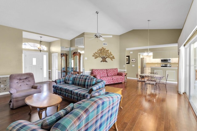 7472 Clearmeadow Dr, Spring Hill, FL 34606 - living area featuring visible vents, high vaulted ceiling, and wood finished floors