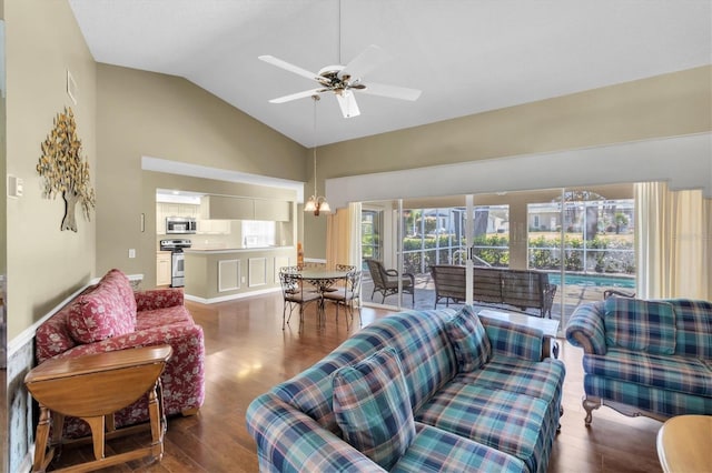 7472 Clearmeadow Dr, Spring Hill, FL 34606 - living room with vaulted ceiling, a ceiling fan, and wood finished floors