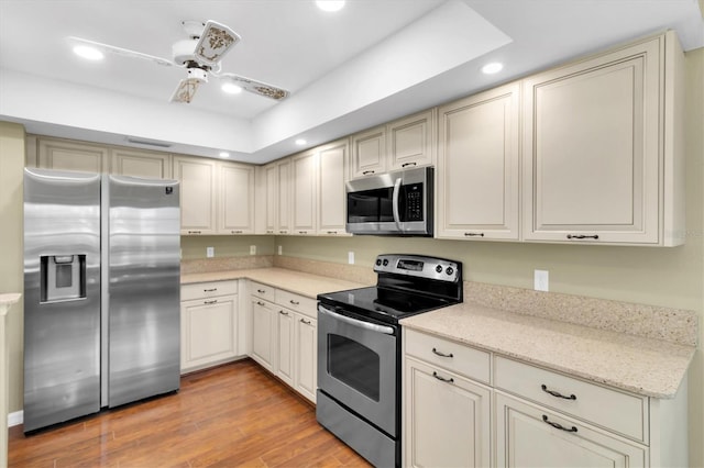 7472 Clearmeadow Dr, Spring Hill, FL 34606 - kitchen featuring recessed lighting, appliances with stainless steel finishes, light wood-style flooring, and ceiling fan