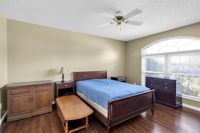 7472 Clearmeadow Dr, Spring Hill, FL 34606 - bedroom with ceiling fan, dark wood-type flooring, multiple windows, and a textured ceiling