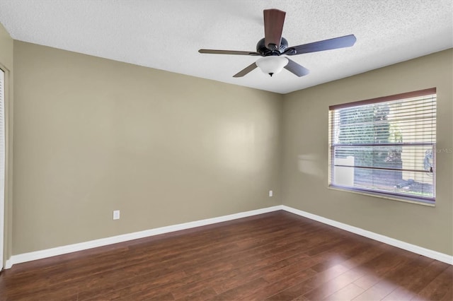 7472 Clearmeadow Dr, Spring Hill, FL 34606 - unfurnished room featuring baseboards, dark wood-type flooring, ceiling fan, and a textured ceiling
