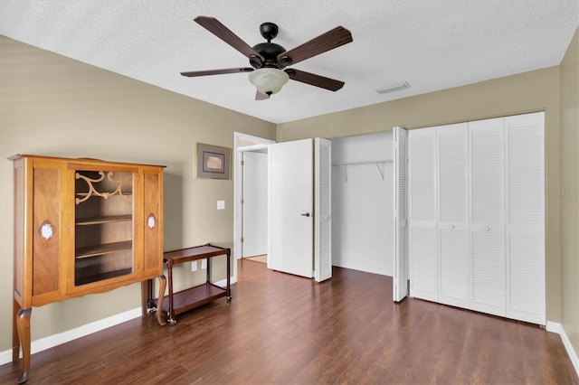 7472 Clearmeadow Dr, Spring Hill, FL 34606 - bedroom featuring wood finished floors, visible vents, two closets, and a textured ceiling