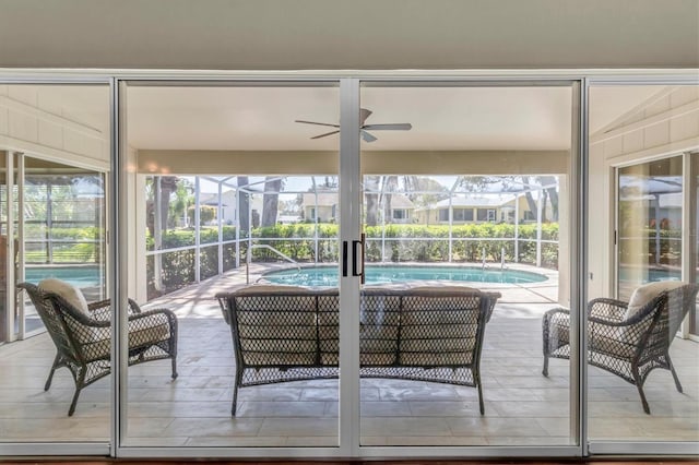 7472 Clearmeadow Dr, Spring Hill, FL 34606 - sunroom featuring a swimming pool and a ceiling fan