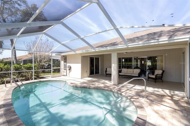 7472 Clearmeadow Dr, Spring Hill, FL 34606 - outdoor pool featuring a patio area, glass enclosure, and an outdoor hangout area