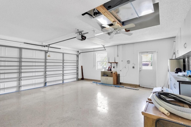 7472 Clearmeadow Dr, Spring Hill, FL 34606 - garage with a garage door opener and baseboards