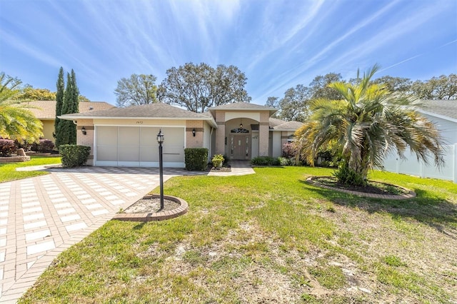 7472 Clearmeadow Dr, Spring Hill, FL 34606 - view of front of house featuring stucco siding, driveway, an attached garage, and a front yard