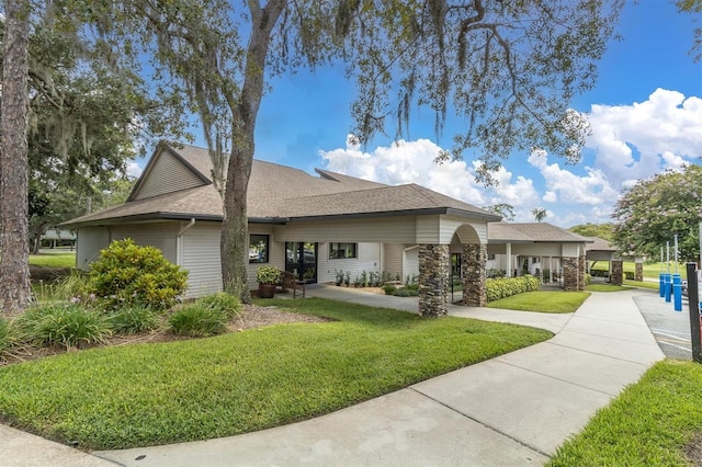 7472 Clearmeadow Dr, Spring Hill, FL 34606 - view of front of house with roof with shingles and a front lawn