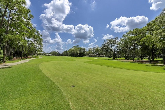 7472 Clearmeadow Dr, Spring Hill, FL 34606 - view of home's community with view of golf course and a lawn