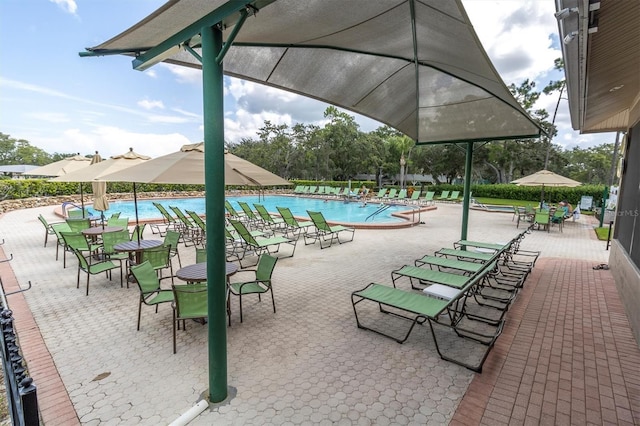 7472 Clearmeadow Dr, Spring Hill, FL 34606 - exterior space featuring a swimming pool and a patio area