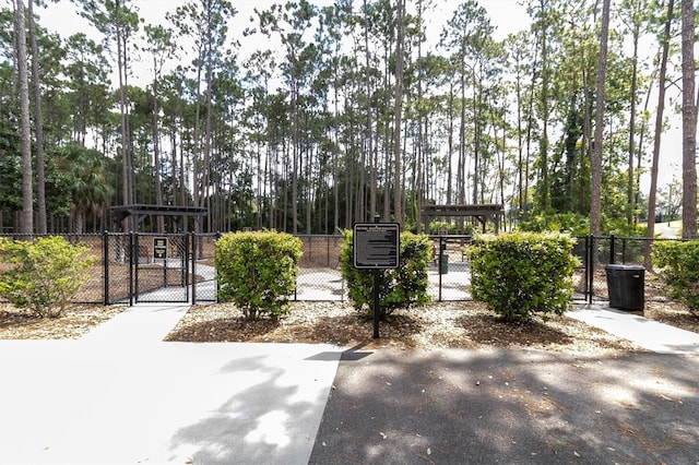7472 Clearmeadow Dr, Spring Hill, FL 34606 - view of community featuring fence and a gate