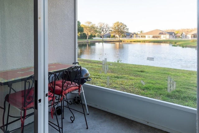 sunroom with a water view