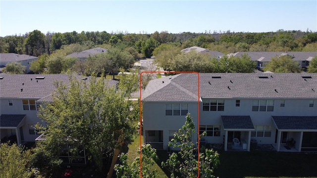 birds eye view of property with a residential view