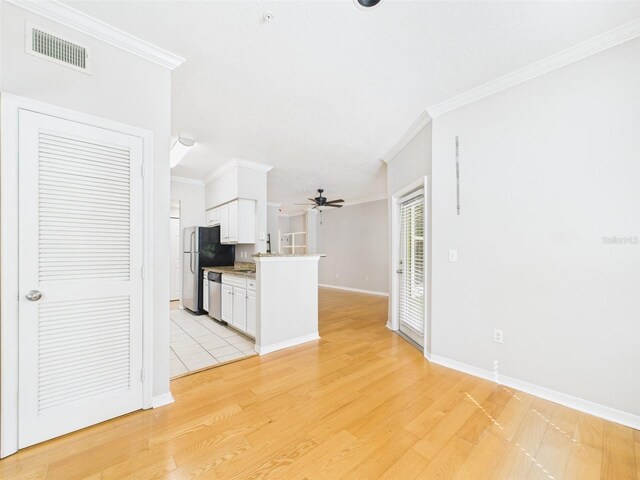 1810 E Palm Ave Unit 6104, Tampa, FL 33605 - unfurnished living room featuring a ceiling fan, ornamental molding, light wood finished floors, and baseboards