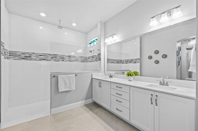 bathroom featuring walk in shower, a sink, recessed lighting, and double vanity