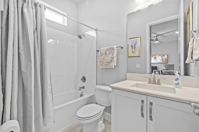 bathroom with tile patterned floors, toilet, a ceiling fan, shower / tub combo with curtain, and vanity