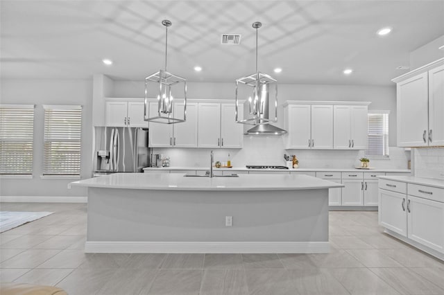 3966 Tour Trce, Land O Lakes, FL 34638 - kitchen featuring stainless steel fridge, exhaust hood, a sink, plenty of natural light, and recessed lighting