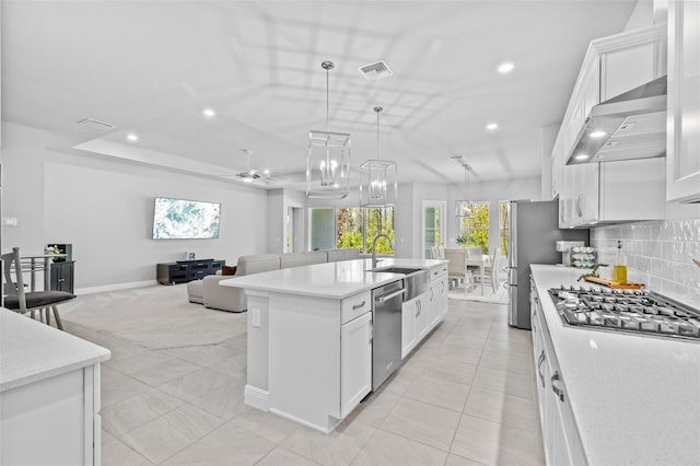 3966 Tour Trce, Land O Lakes, FL 34638 - kitchen featuring stainless steel appliances, a sink, recessed lighting, open floor plan, and wall chimney exhaust hood