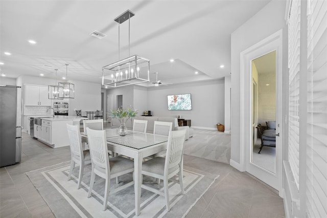 3966 Tour Trce, Land O Lakes, FL 34638 - dining room featuring recessed lighting, light tile patterned floors, a ceiling fan, and a chandelier