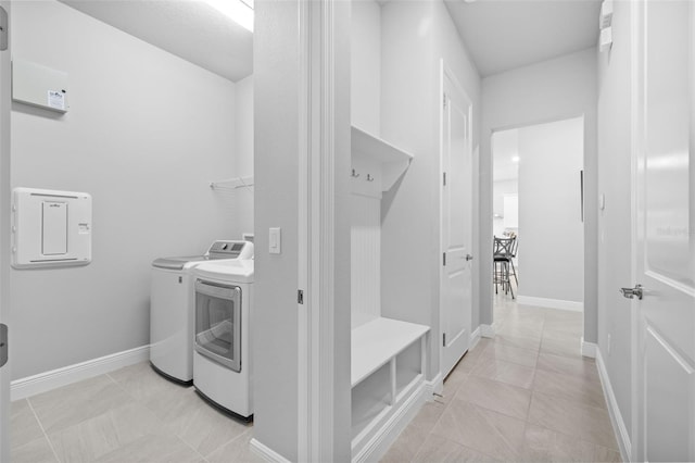 3966 Tour Trce, Land O Lakes, FL 34638 - laundry area featuring washing machine and clothes dryer and baseboards