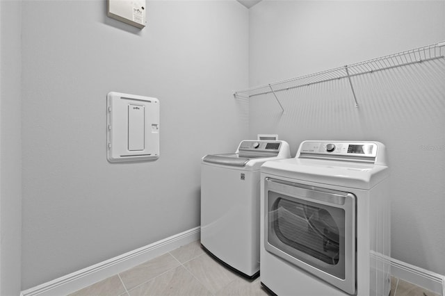 3966 Tour Trce, Land O Lakes, FL 34638 - laundry room with washing machine and clothes dryer and baseboards