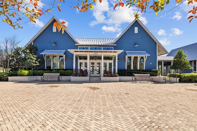 3966 Tour Trce, Land O Lakes, FL 34638 - back of property with french doors, metal roof, and a standing seam roof