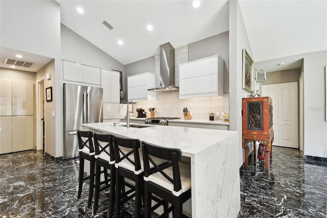 441 Village Dr, Tarpon Springs, FL 34689 - kitchen with appliances with stainless steel finishes, wall chimney exhaust hood, dark marble finish floors, a sink, and modern cabinets