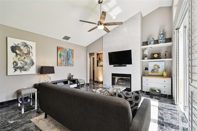 441 Village Dr, Tarpon Springs, FL 34689 - living area with lofted ceiling, marble tiled flooring, ceiling fan, built in shelves, and a high end fireplace