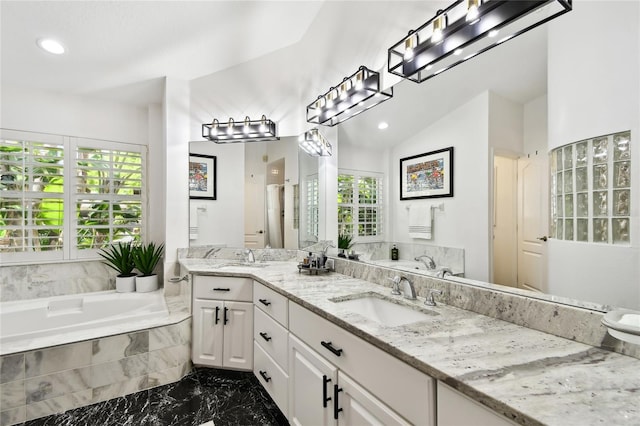 441 Village Dr, Tarpon Springs, FL 34689 - full bathroom with marble finish flooring, a garden tub, recessed lighting, and double vanity