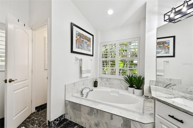 441 Village Dr, Tarpon Springs, FL 34689 - bathroom with a bath, vanity, marble finish flooring, and recessed lighting