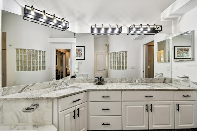 441 Village Dr, Tarpon Springs, FL 34689 - full bath with double vanity, toilet, and ensuite bath
