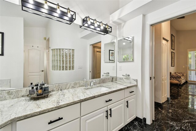 441 Village Dr, Tarpon Springs, FL 34689 - full bath with marble tiled flooring, ensuite bathroom, and vanity