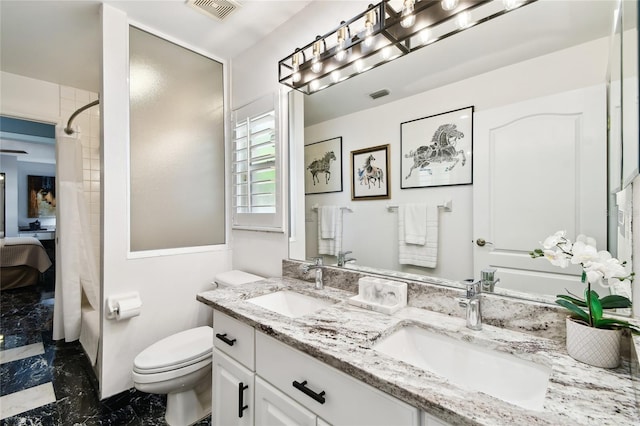 441 Village Dr, Tarpon Springs, FL 34689 - full bath featuring marble tiled flooring, toilet, double vanity, and a shower