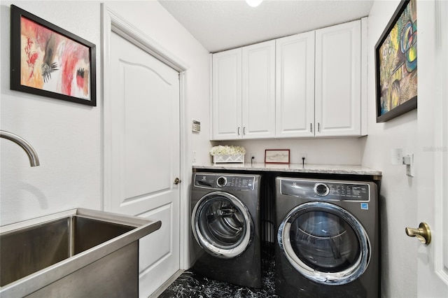 441 Village Dr, Tarpon Springs, FL 34689 - clothes washing area featuring separate washer and dryer, cabinet space, and marble finish floors