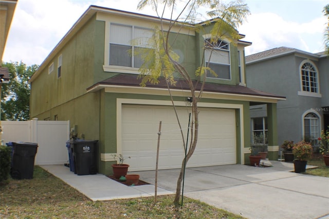 716 Burlwood St, Brandon, FL 33511 - view of front of property featuring a garage, concrete driveway, and stucco siding