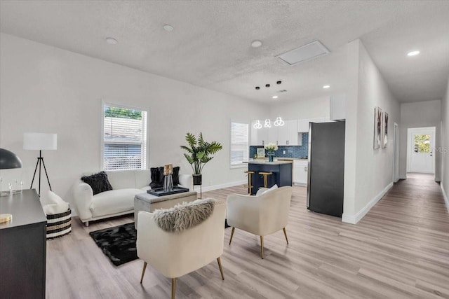 3101 N 15th St, Tampa, FL 33605 - living area with recessed lighting, baseboards, a textured ceiling, and light wood finished floors