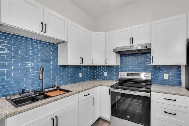 3101 N 15th St, Tampa, FL 33605 - kitchen featuring white cabinetry, electric stove, under cabinet range hood, and a sink