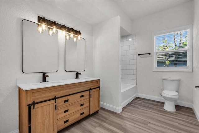 3101 N 15th St, Tampa, FL 33605 - full bath with toilet, wood finished floors, baseboards, and a sink