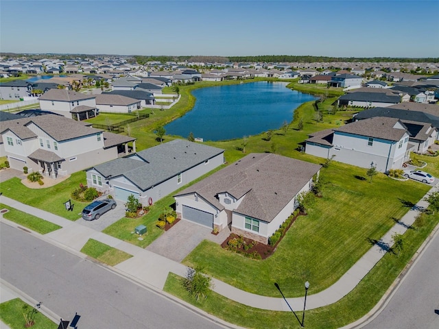 aerial view featuring a water view and a residential view