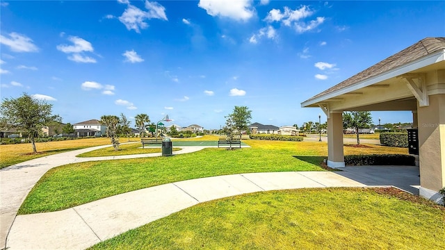 view of home's community with a yard and a residential view
