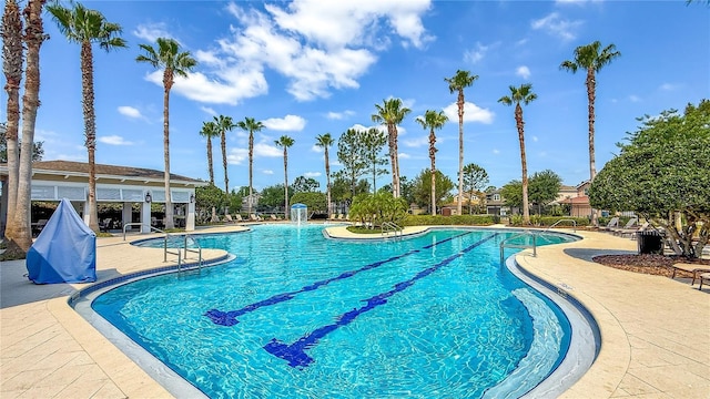 community pool featuring a patio area