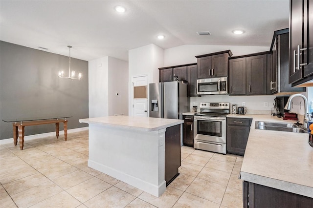 kitchen featuring a sink, stainless steel appliances, an inviting chandelier, light countertops, and light tile patterned floors