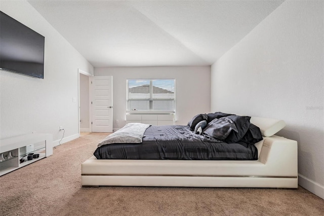 carpeted bedroom featuring baseboards
