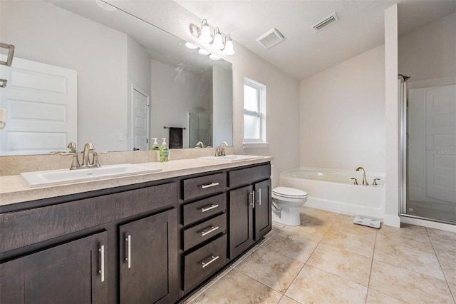 bathroom with a sink, visible vents, and tile patterned floors