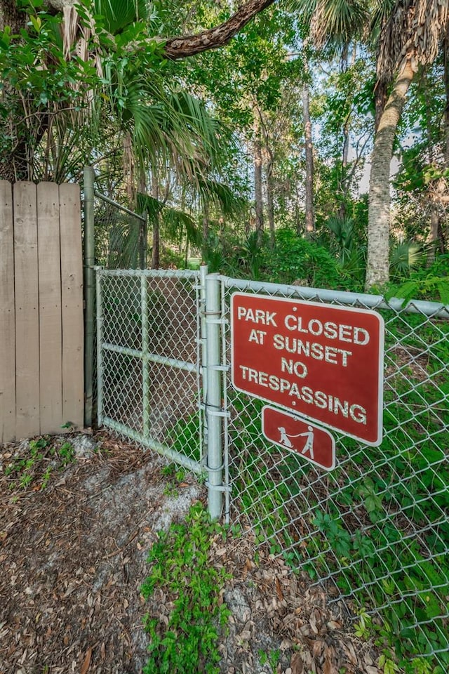 exterior details featuring fence and a gate