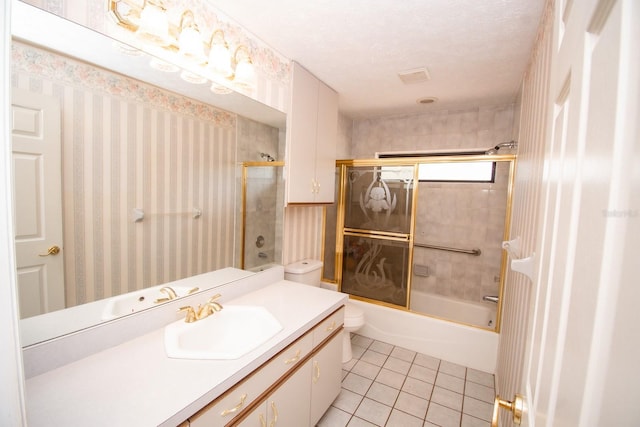 bathroom with tile patterned floors, vanity, and shower / bath combination with glass door